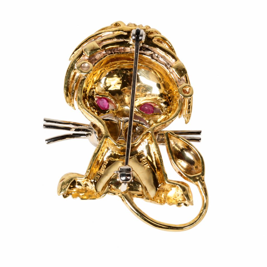 Gallery image of this Women’s 18k Yellow Gold Kigu Lion Brooch with Pink & Blue Sapphire and Diamond
